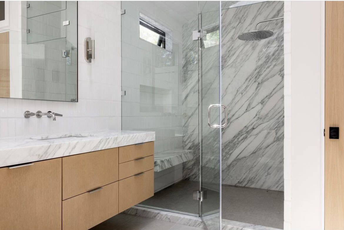 High-end bathroom transformation with marble finishes in Beverly Hills, CA